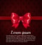 Big red ribbon bow on the rich classic dark pattern background with place for your text. VIP Luxury red card template