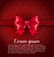Big red ribbon bow on the rich classic red pattern background with place for your text. VIP Luxury red card template