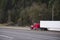 Big rig classic red semi truck with refrigerator semi trailer ru