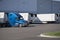 Big rig semi truck with refrigerated semi trailer standing for l