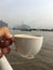 Big river in Bangkok morning shot from the shore a cup of coffee