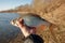 Big roach fish in fisherman\'s hand, float fishing on a river, clear sunny spring weather