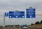 Big road signs on the busy French highway to go to Paris