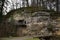 Big rock with bird house near Harasov lake on 16th january in czech republic