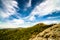 Big Rock Mountain (Pedra Grande) in Atibaia, Sao Paulo, Brazil with forest, deep blue sky and clouds