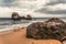 Big rock on the overcast beach in Sri Lanka