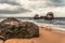 Big rock on the overcast beach in Sri Lanka