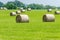 Big round hay bails on a midwest farm.