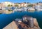 Big rusted mooring bollard in old port of Ajaccio