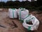 Big sand bags on construction site. A large sandbag ready for building.