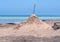 Big sand volcano on the beach