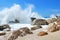 Big sea wave splashing over the shore rocks