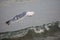 Big seagull flies free over the water of ocean