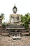 Big seated buddha statue sukhothai wat thailand