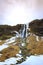 Big Seljalandsfoss waterfalls in snowy Winter Iceland