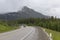 Big semi truck coming around the bend among the mountains