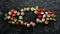 Big set of pieces of sushi rolls on black stone background. Top view.