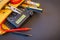 Big set of tools in suede bag on black background prepared by the master electrician before repair or construction