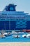 Big ship from a company Pullmantur, names Zenith, on a harbor a small Spanish town Palamos in Costa Brava. 10. 03. 2018 Spain