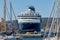 Big ship from a company Pullmantur, names Zenith, on a harbor a small Spanish town Palamos in Costa Brava. 10. 03. 2018 Spain