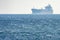 Big ship mirage on sea horizon line
