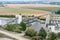 Big silos, belt conveyors and mining equipment in a quarry. Quarrying of stones for construction works. Mining industry in quarry.