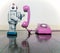 Big silver robot toy on a pink phone standing