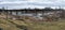 The Big Sioux River flows over rocks in Sioux Falls South Dakota with views of wildlife, ruins, park paths, train track bridge, tr