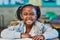 Big smiles for the lessons to be learnt today. Cropped shot of an elementary school girl in the classroom.