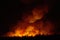 Big smoke from the burning sugarcane fields at night.