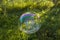 Big soap bubble flying in the air