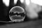 Big soap bubble on stick. Monochrome