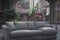 Big sofa on city street. Soft comfortable couch in middle of street. Concept of place of rest. Generative AI.