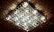 Big square chandelier with many crystals and working lamps