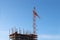 Big stationary hoist and building under construction