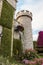 Big stone fairytale castle in botanical Dubai Miracle Garden with different floral fairy-tale themes in Dubai city, United Arab
