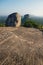 Big Stone on Pidurangala Rock with circle carving with view on Lions Rock in Sigiriya, Sri Lanka