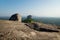 Big Stone on Pidurangala Rock with view on Lions Rock with mountain background in Sigiriya, Sri Lanka