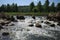 Big stones in litlle waterfall at sunny day