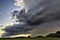 Big summer rainy cloud over countryside