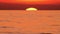 Big Sun at Sunset 4k over Sea or Ocean Time Lapse, Closeup Telephoto Lens. Travel, Beginning, Nature Concept