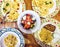 Big table with traditional meals and salad