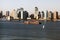 A big tanker passing by Hudson river and New Jersey skyline