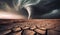 Big tornado storm above the desolate land. Dry cracked ground field and weather disasters caused by the global climate change.
