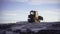 Big tractor at the north pole. CLIP. In the foreground, a tractor is pulling a heavy load. In the video, people walk and