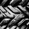 Big truck mud tires, close up. Bw.