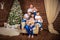 Big united happy family at festive table near Christmas tree