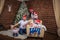 Big united happy family at festive table near Christmas tree