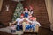 Big united happy family at festive table near Christmas tree