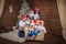 Big united happy family at festive table near Christmas tree